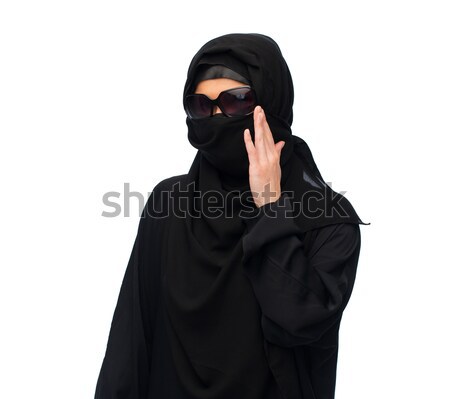 muslim woman in hijab and sunglasses over white Stock photo © dolgachov