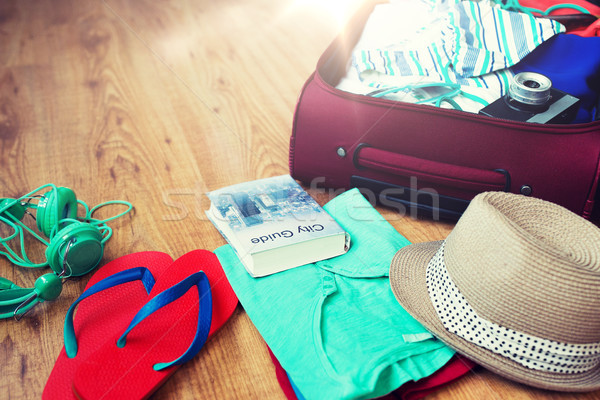 close up of travel bag with clothes and stuff Stock photo © dolgachov