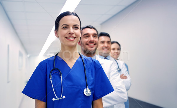 group of happy medics or doctors at hospital Stock photo © dolgachov