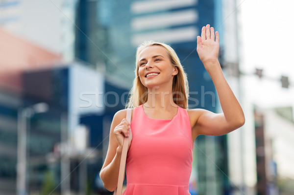 Boldog fiatal nő integet kéz figyelmeztetés kézmozdulat Stock fotó © dolgachov