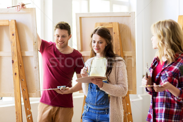 group of young artists painting at art school Stock photo © dolgachov