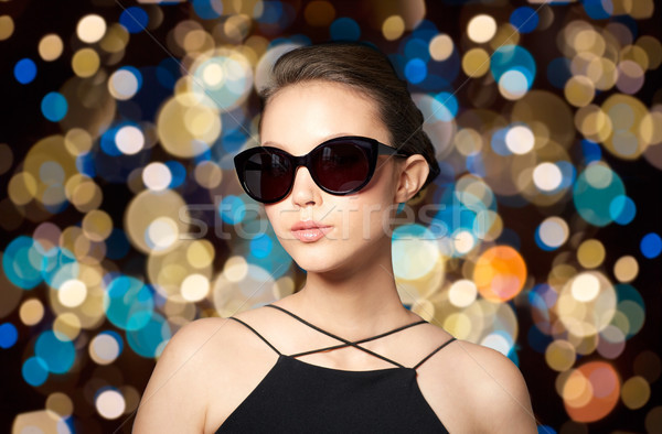 beautiful young woman in elegant black sunglasses Stock photo © dolgachov