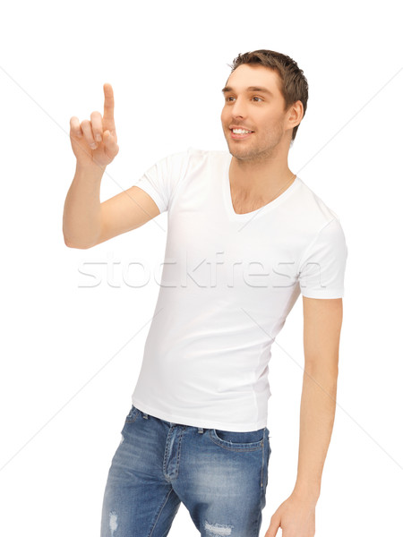 Człowiek biały shirt pracy coś wyimaginowany Zdjęcia stock © dolgachov