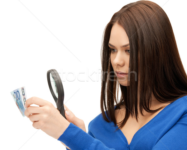 woman with magnifying glass and euro cash money Stock photo © dolgachov
