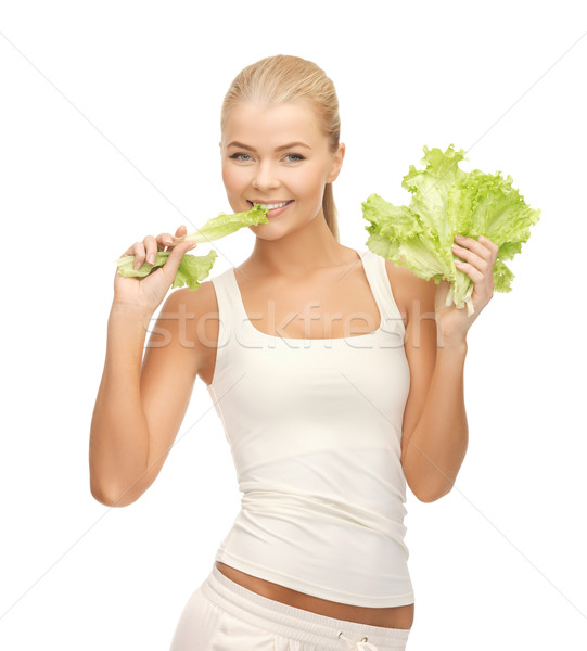 Stock photo: woman biting lettuce