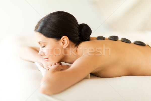 woman in spa with hot stones Stock photo © dolgachov