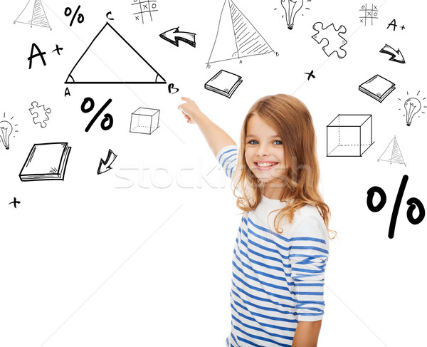 girl pointing to triangle on virtual screen Stock photo © dolgachov
