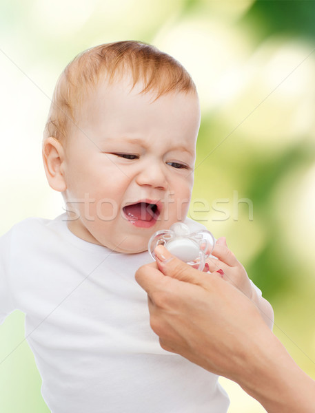 crying baby with dummy Stock photo © dolgachov