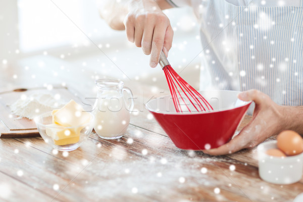 close up of man whipping something in bowl Stock photo © dolgachov