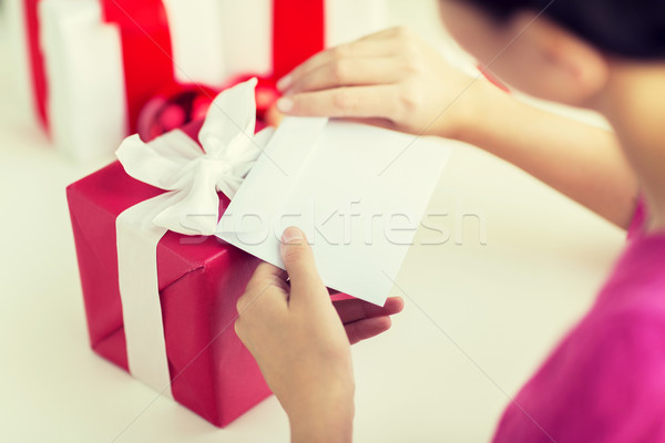 Stock photo: close up of woman with letter and presents