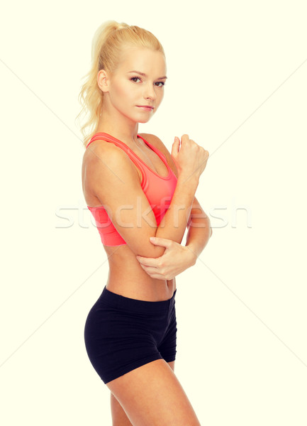 sporty woman with pain in elbow Stock photo © dolgachov