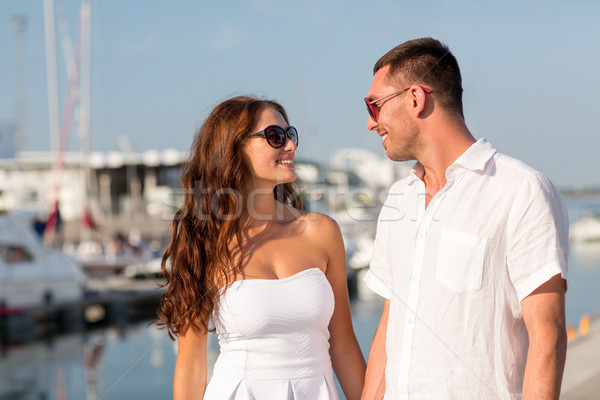 smiling couple in city Stock photo © dolgachov