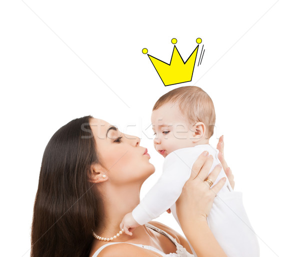 happy mother kissing and holding baby Stock photo © dolgachov
