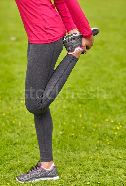 close up of woman stretching leg outdoors Stock photo © dolgachov