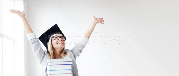 happy student in graduation cap Stock photo © dolgachov