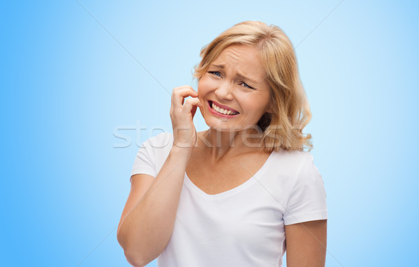 Stock photo: unhappy woman suffering from face inch