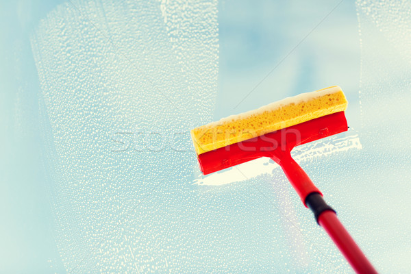 close up of hand cleaning window with sponge Stock photo © dolgachov