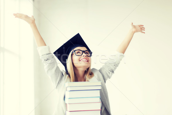 Stock photo: happy student in graduation cap