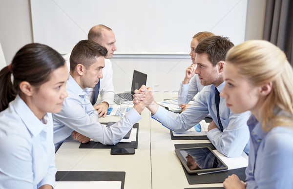 Stock photo: smiling business people having conflict in office