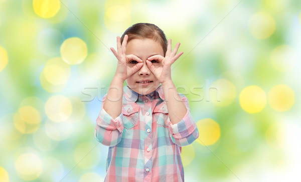 happy little girl making faces and having fun Stock photo © dolgachov