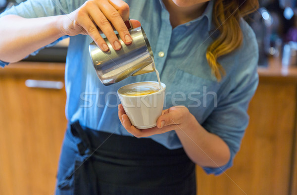 close up of woman making coffee at shop or cafe Stock photo © dolgachov