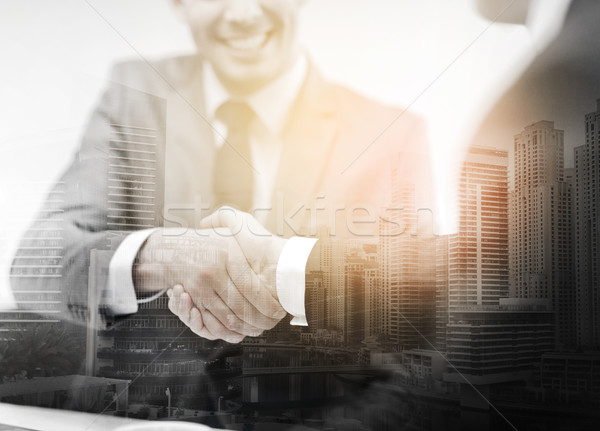 Dwa biznesmenów drżenie rąk biuro działalności ręce Zdjęcia stock © dolgachov