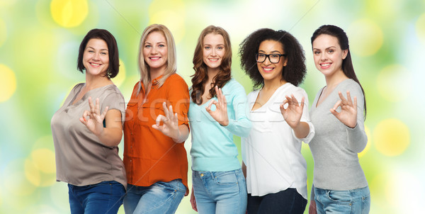 group of happy different size women showing ok Stock photo © dolgachov