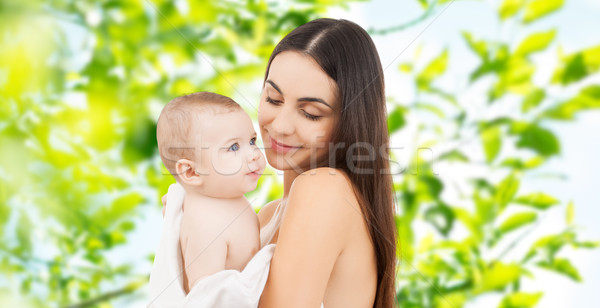 happy mother holding adorable baby Stock photo © dolgachov