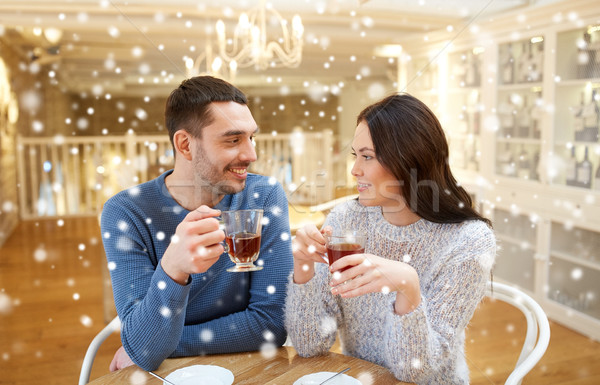 happy couple drinking tea at cafe Stock photo © dolgachov