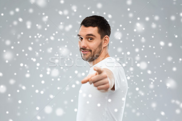 man pointing finger to you over snow background Stock photo © dolgachov