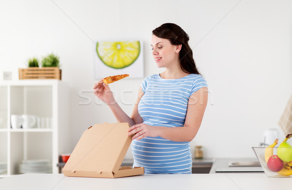 Stockfoto: Gelukkig · zwangere · vrouw · eten · pizza · home · keuken