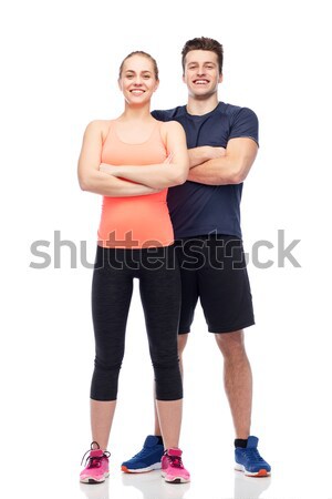 happy sportive man and woman Stock photo © dolgachov