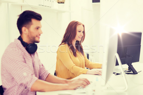 creative team with headphones and computer Stock photo © dolgachov