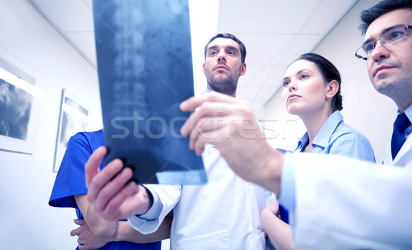 Stock photo: group of medics with spine x-ray scan at hospital