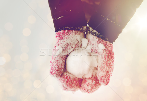 close up of woman holding snowball outdoors Stock photo © dolgachov