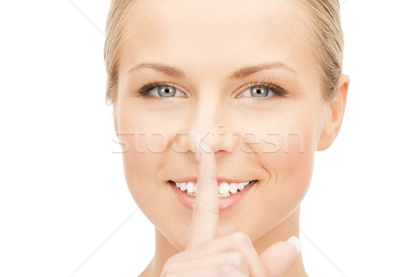 happy woman with finger on lips Stock photo © dolgachov