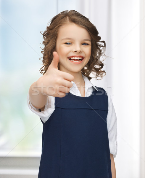 pre-teen girl showing thumbs up Stock photo © dolgachov