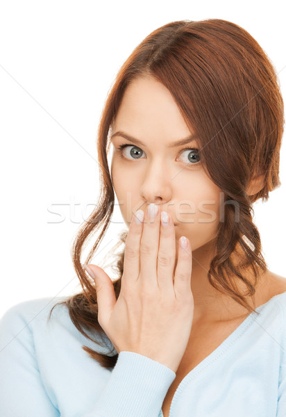 Stock photo: amazed woman with hand over mouth