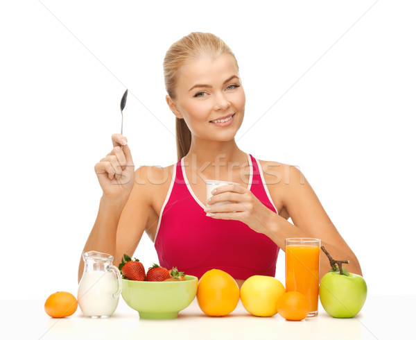 young woman eating healthy breakfast Stock photo © dolgachov