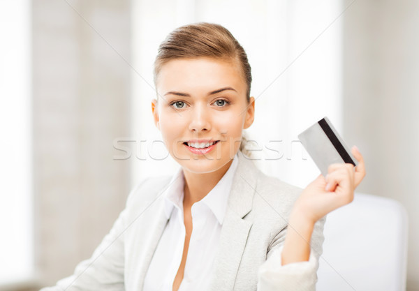 smiling businesswoman showing credit card Stock photo © dolgachov