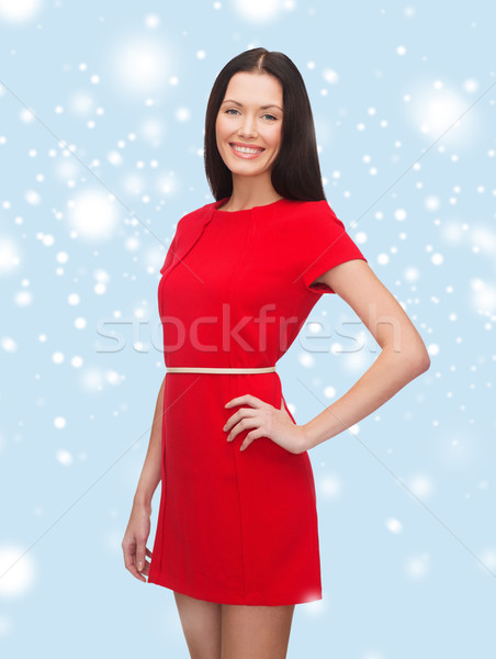 Stock photo: smiling young woman in red dress