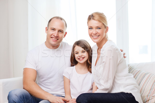 Souriant parents petite fille maison famille enfant [[stock_photo]] © dolgachov