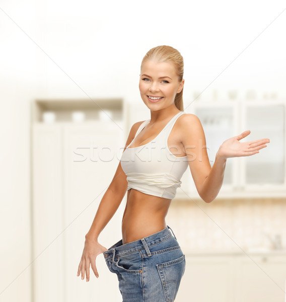Sportlich Frau groß pants Fitness Stock foto © dolgachov