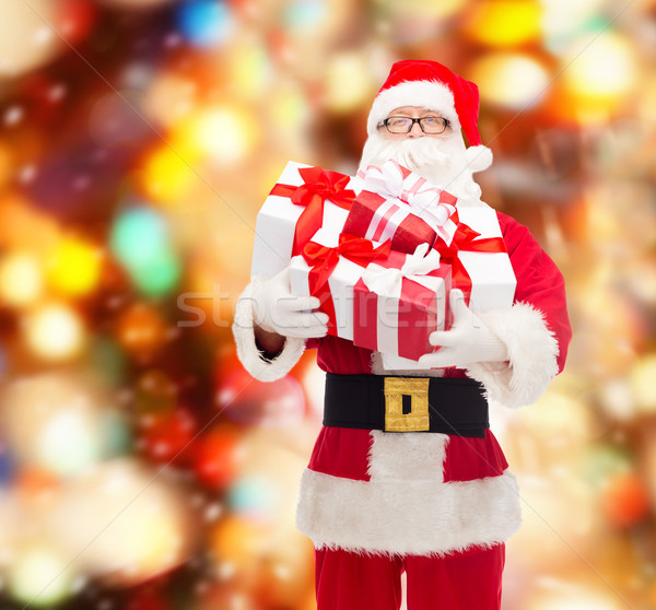 Stock photo: man in costume of santa claus with gift boxes