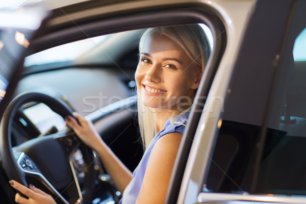 happy woman inside car in auto show or salon Stock photo © dolgachov