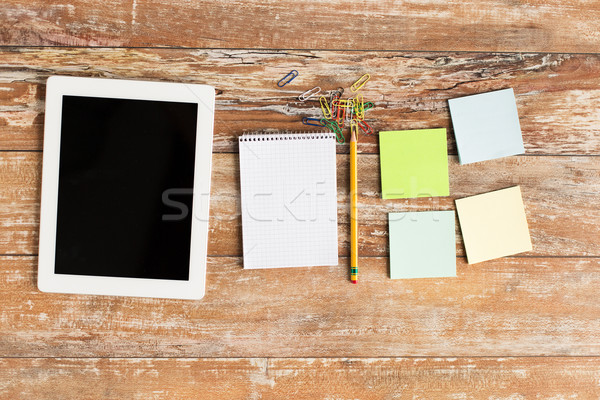 close up of notebook, stickers and tablet pc Stock photo © dolgachov