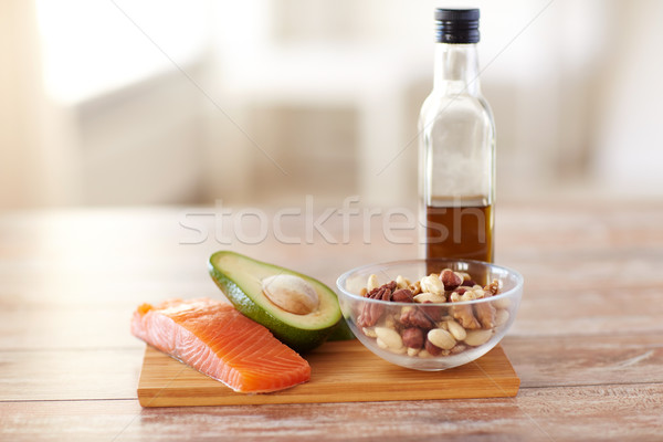 close up of food and olive oil bottle on table Stock photo © dolgachov