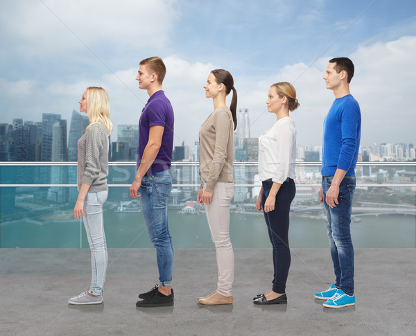 group of people over city waterside background Stock photo © dolgachov