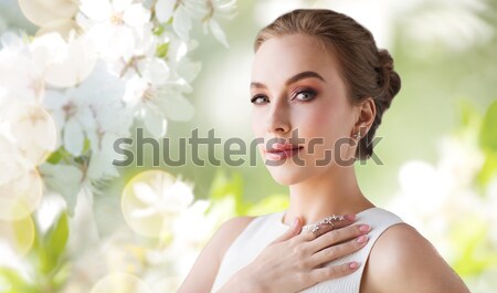 close up of beautiful woman with earrings Stock photo © dolgachov