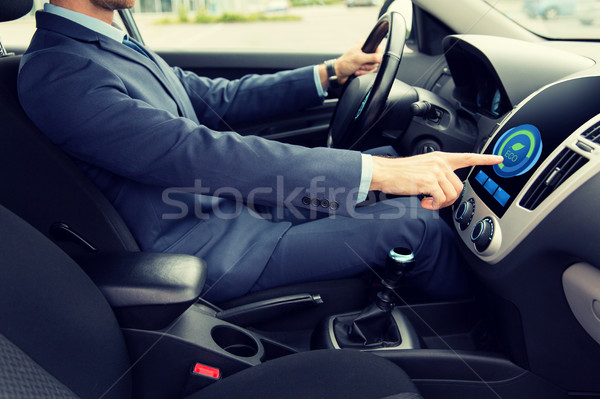 close up of man  driving car in eco mode Stock photo © dolgachov
